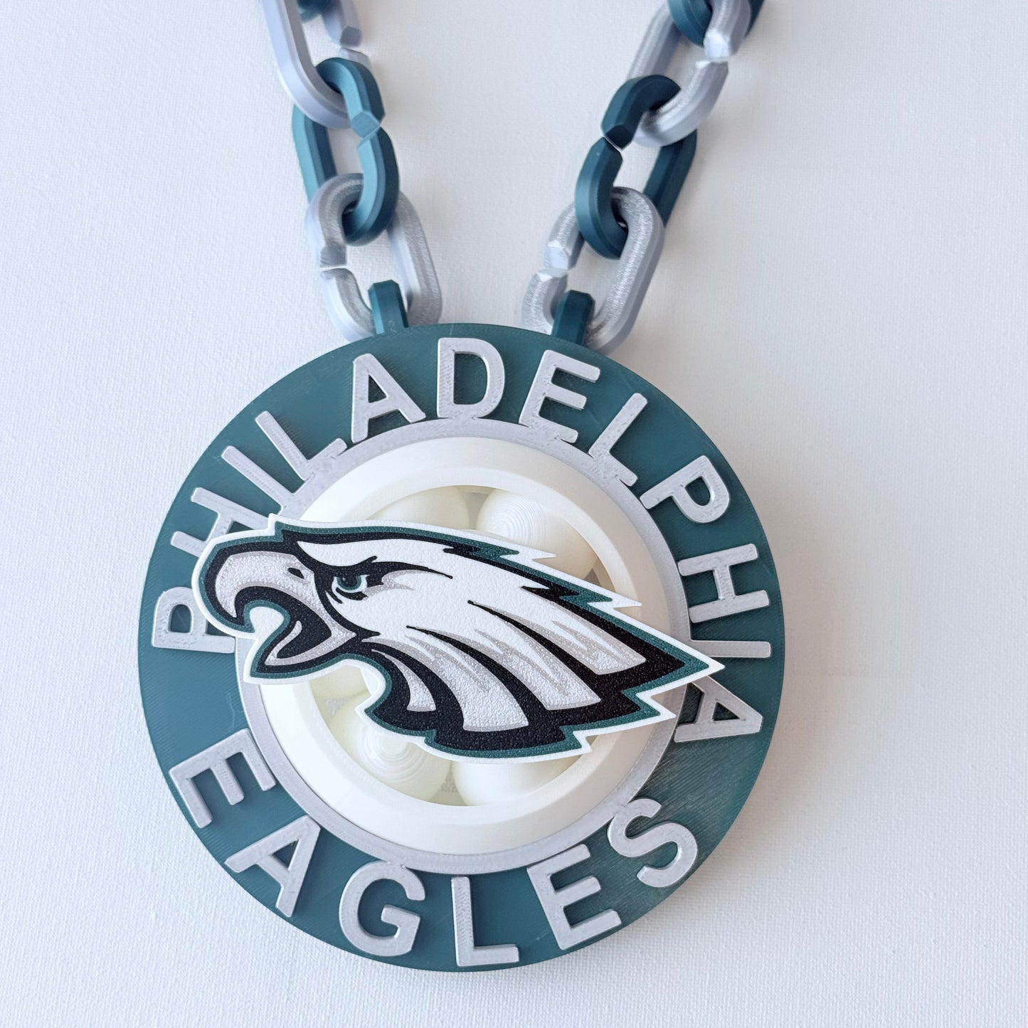 Philadelphia Eagles keychain with chain on a white background