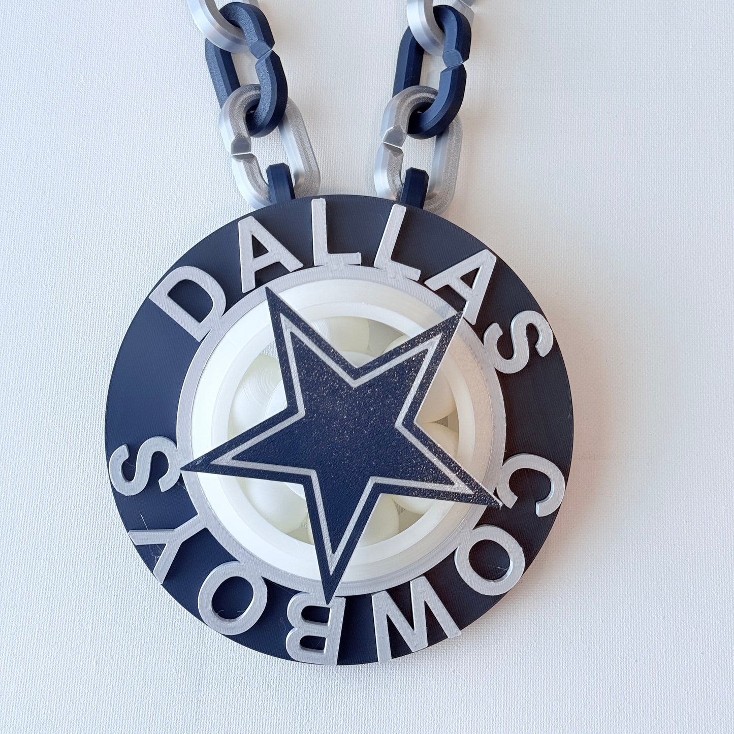 Dallas Cowboys chain with star emblem on a white background
