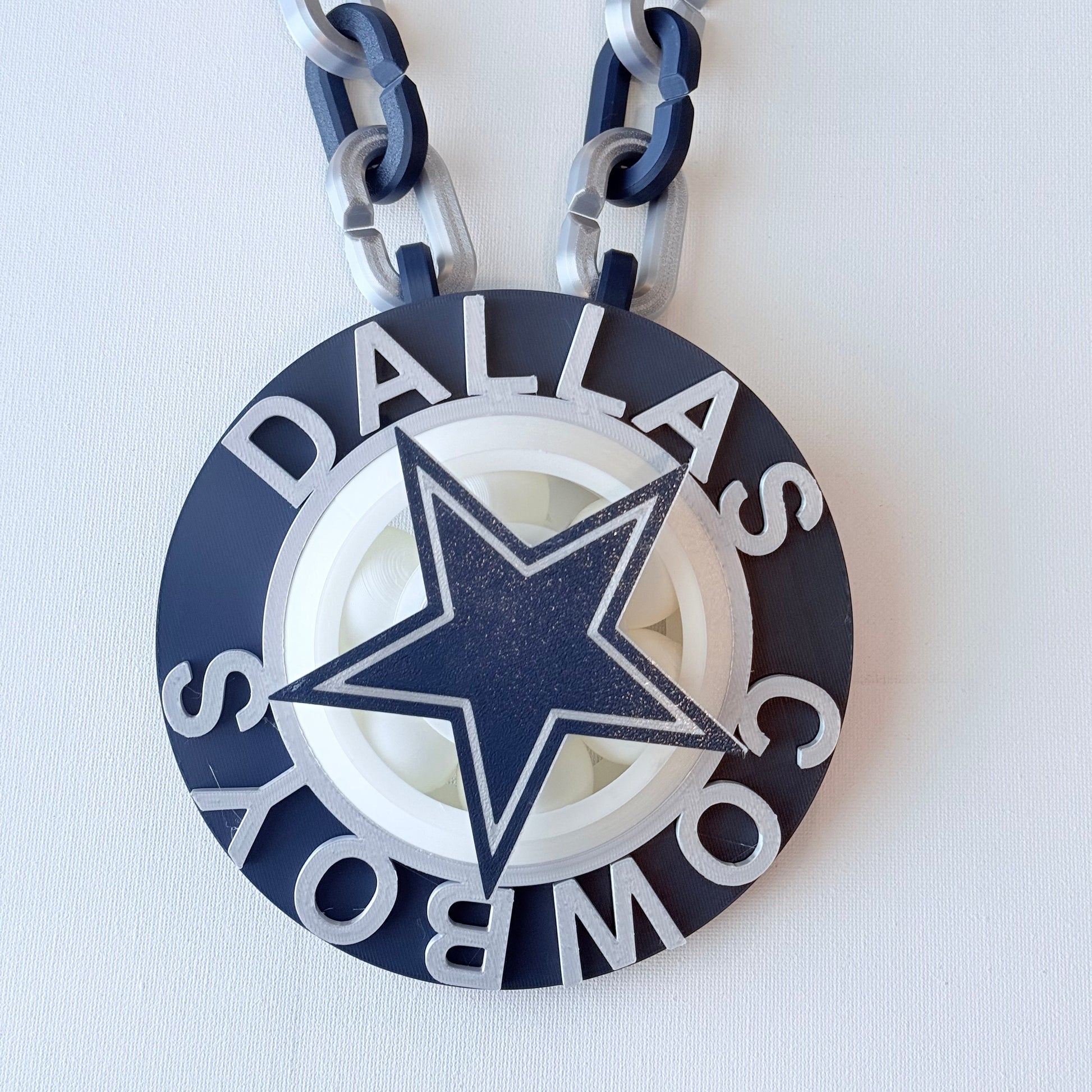 Dallas Cowboys chain with star emblem on a white background