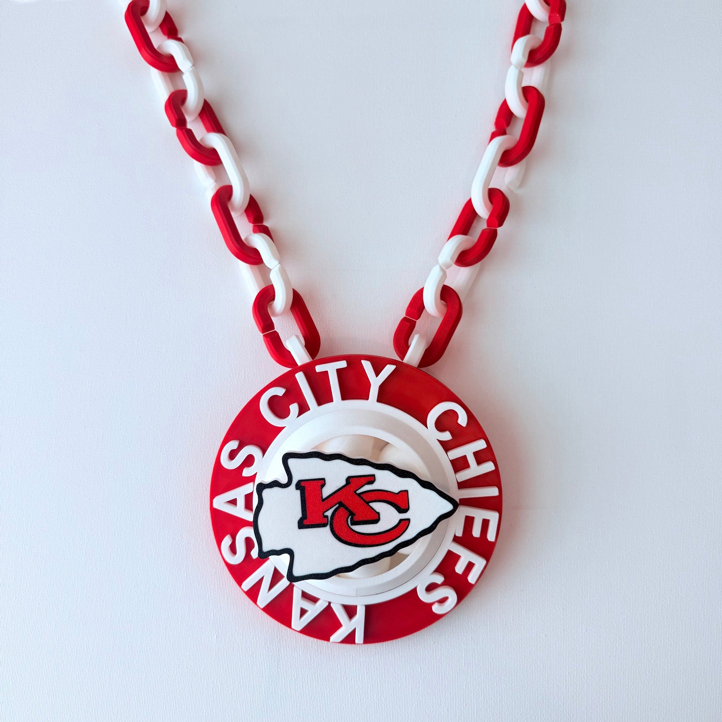 Necklace with Kansas City Chiefs logo on a white background