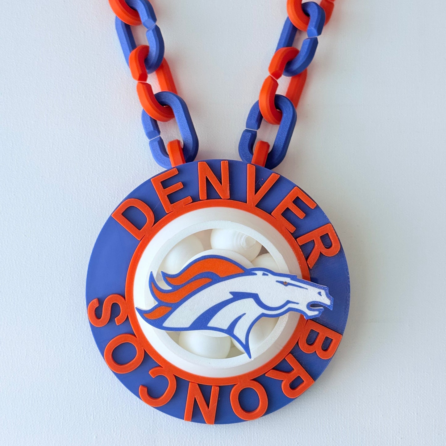 Denver Broncos necklace with chain on a white background